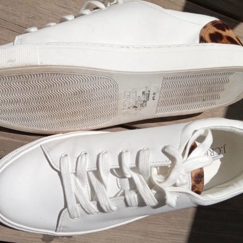 White sneakers with fur-dyed calf hair detail on tongue and upper heel